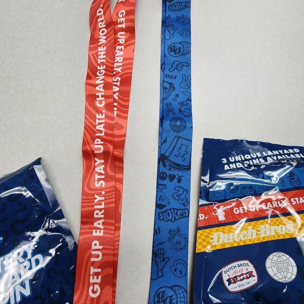 Set Of 2 Dutch Bros Pin and Lanyards 6/25/26 Red/Blue Lightning Bolt Always Stok